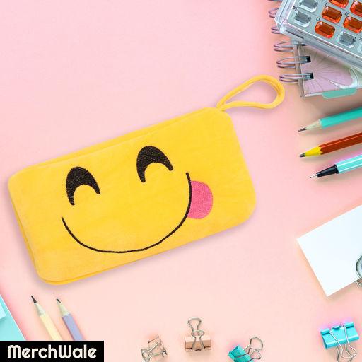 Various colorful stationery for school and office on pink background with copyspace